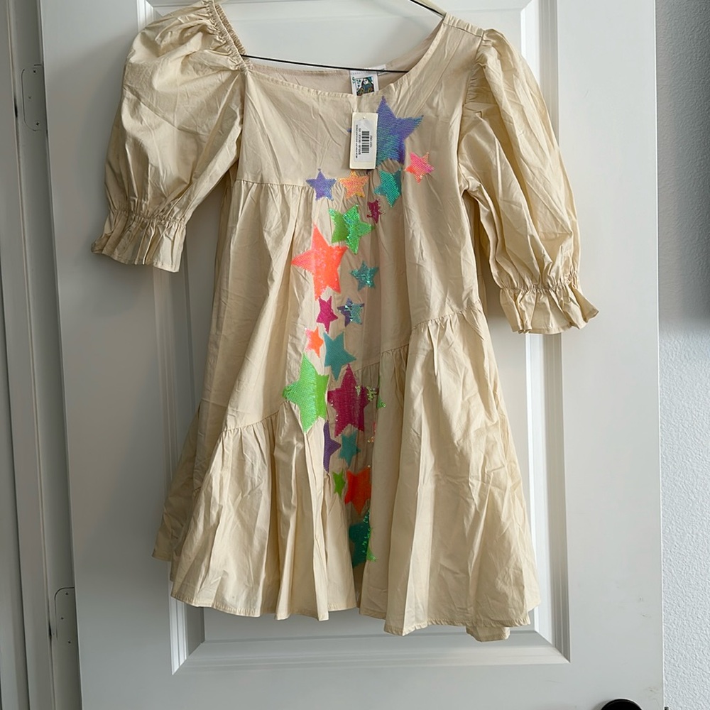 Queen of Sparkles. NWT size XS tan star dress.